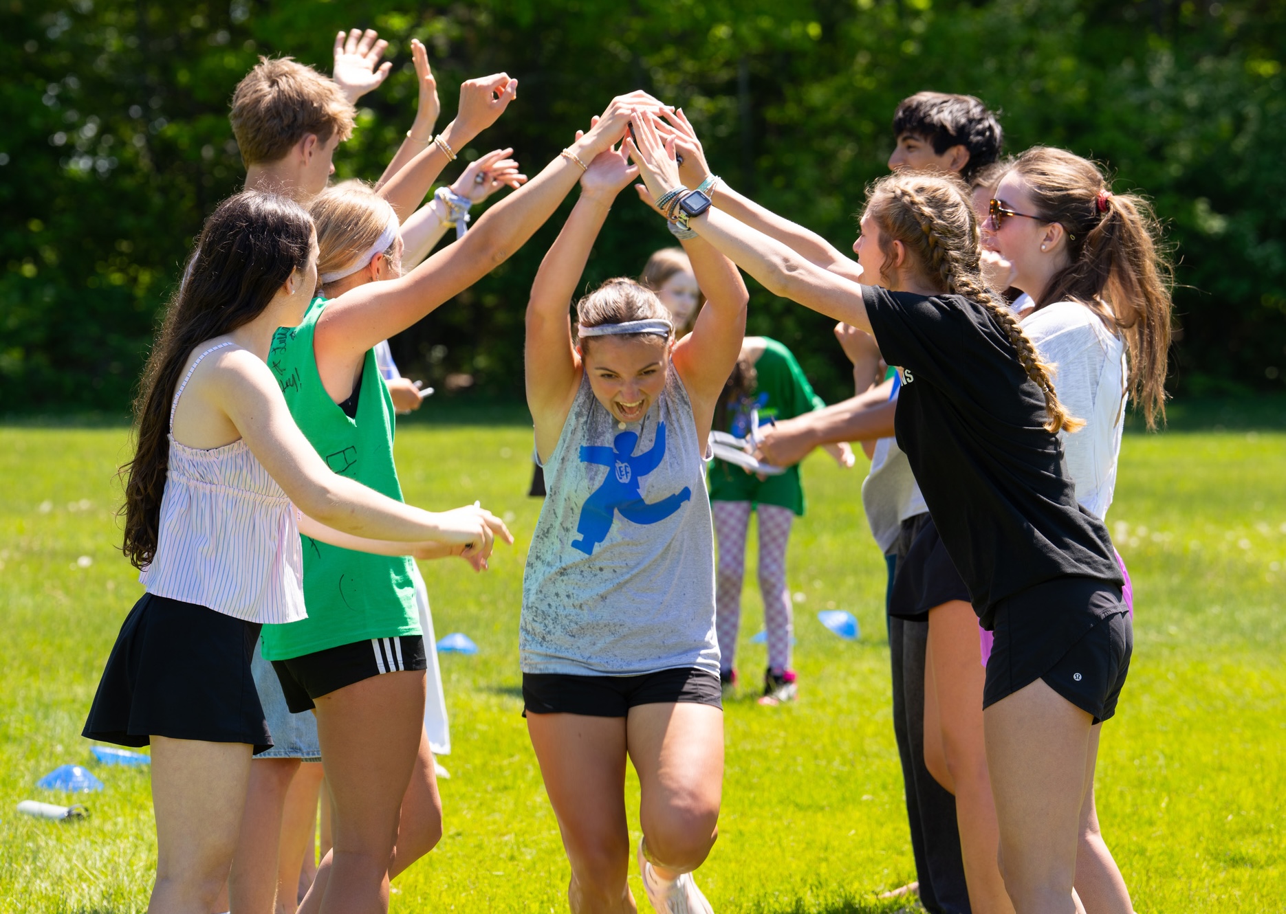 students giving a girl a high five